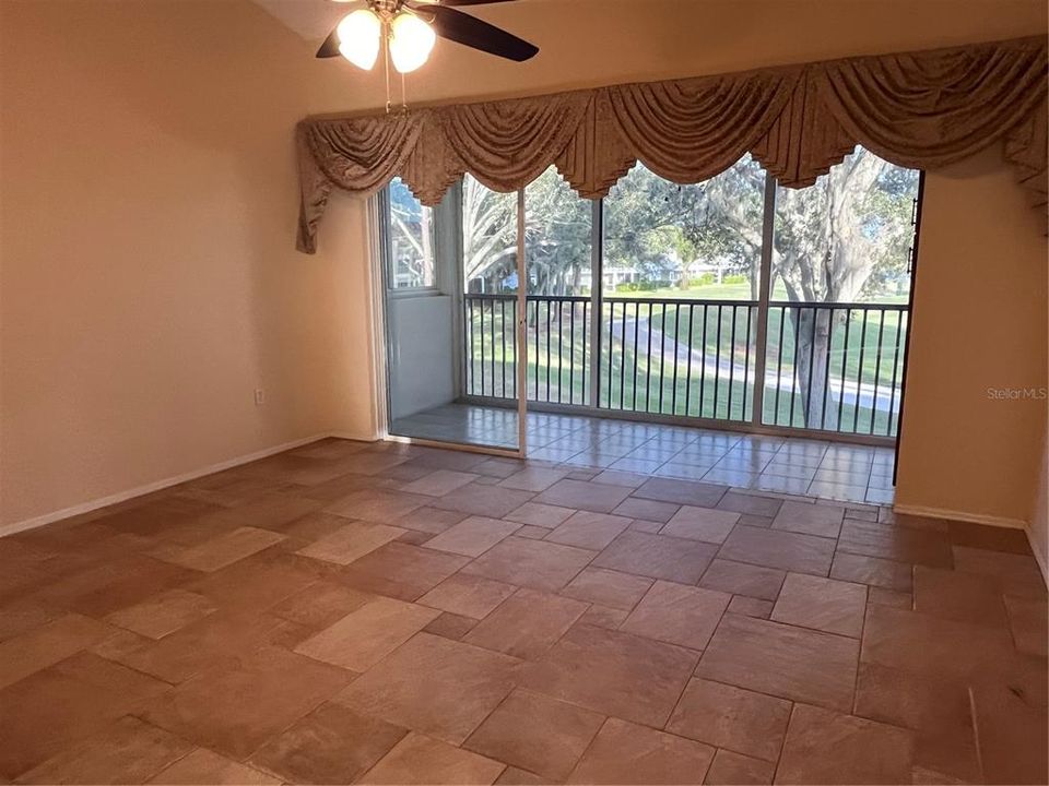 EXPANSIVE GREAT ROOM WITH VAULTED CEILINGS AND ACCESS TO ENCLOSED LANAI OVERLOOKING THE 2ND GREEN AT TARA GOLF & C.C.