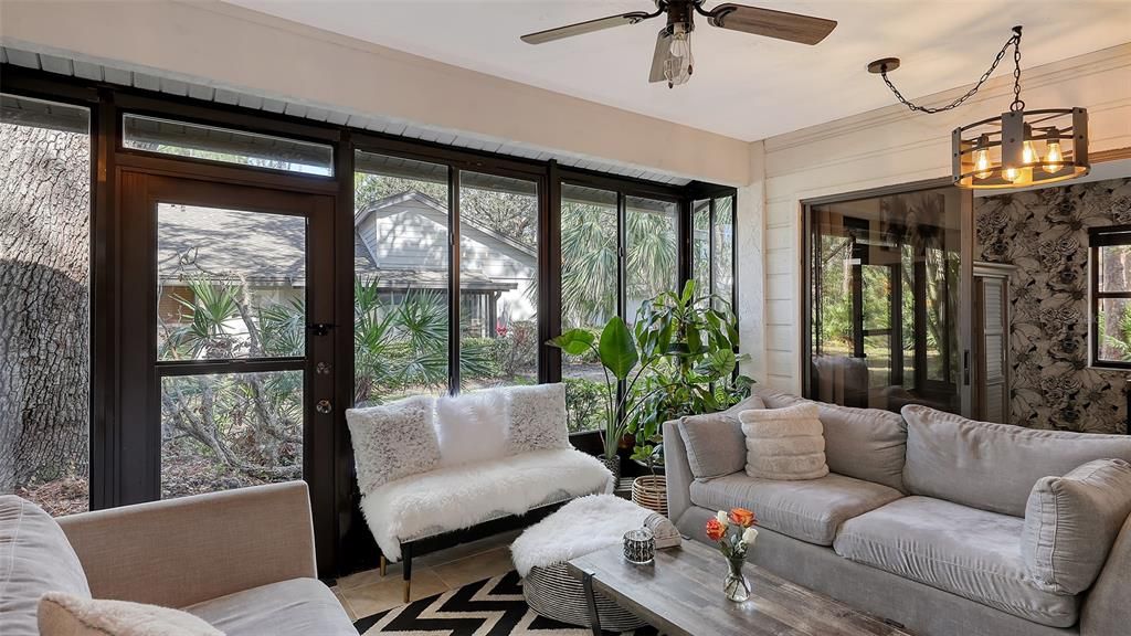 All glass Florida room, flooded with natural light.