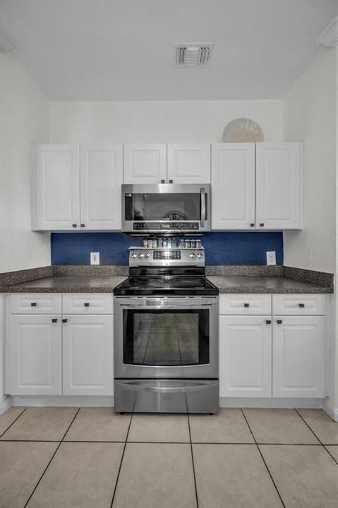 Stainless Steel range with Microwave and lots of cabinets