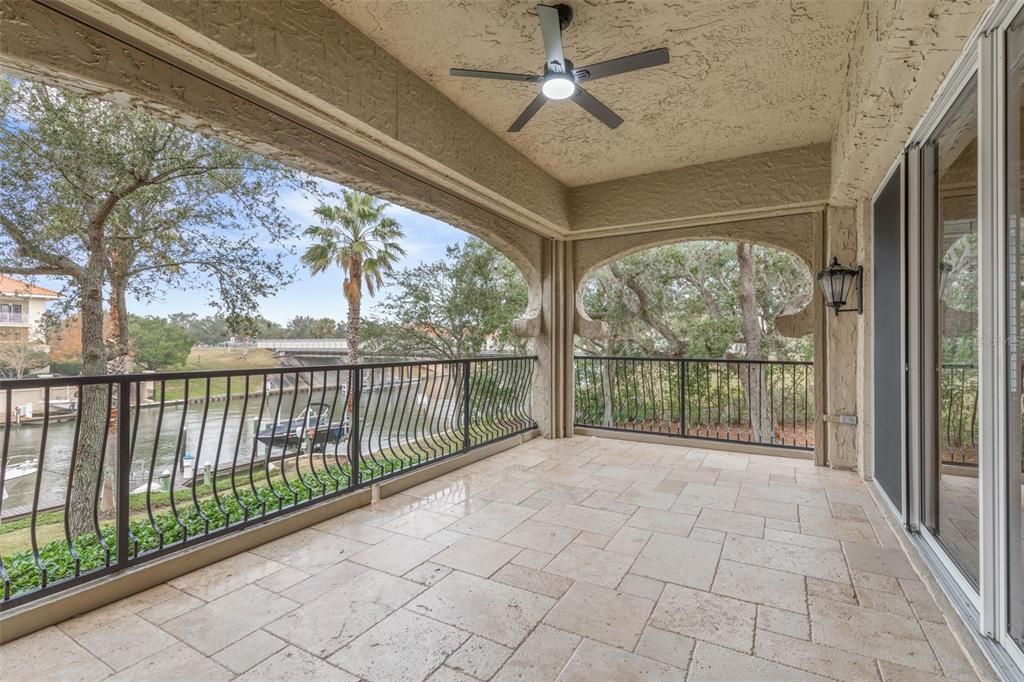 Gorgeous tiled balcony with electric hurricane shutters