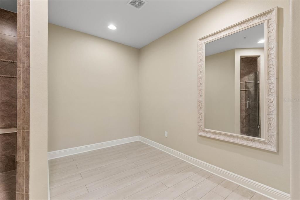 Lots of extra space & large custom mirror in primary bath