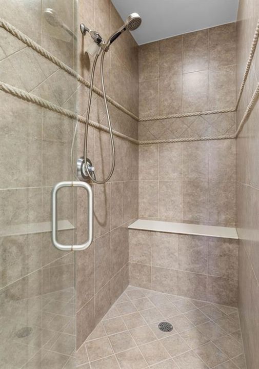 Walk in shower with bench in primary