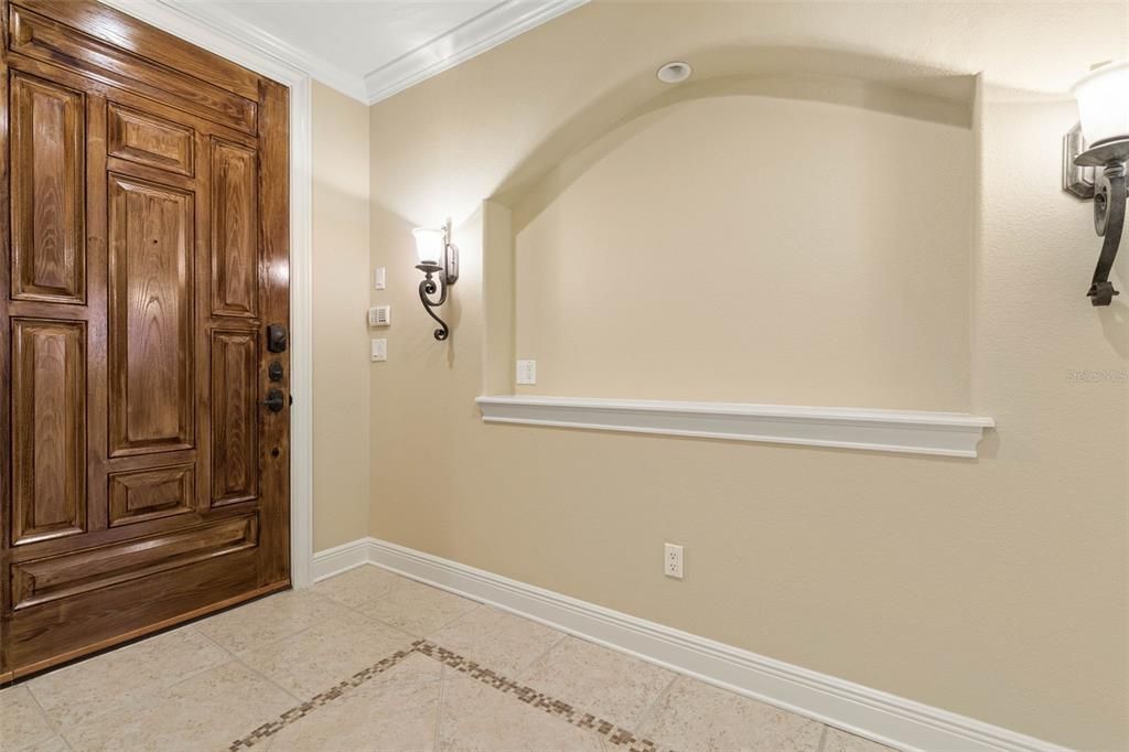 Lighted niche in tiled foyer