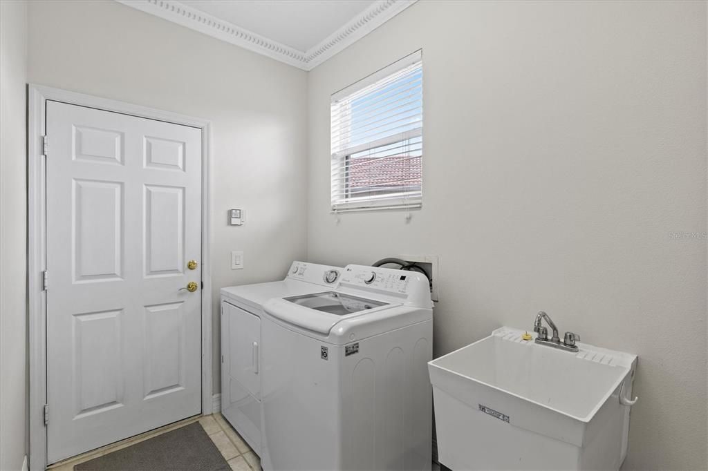 Laundry room/mud room for your daily needs. The door leads out to the double garage.