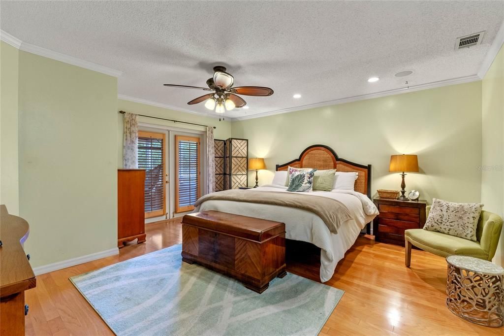 Spacious primary suite with double French Doors to the lanai