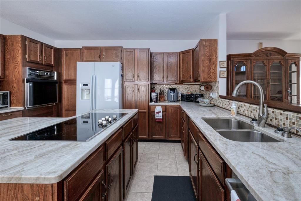 Additional view of large kitchen space with beautiful solid wood cabinets