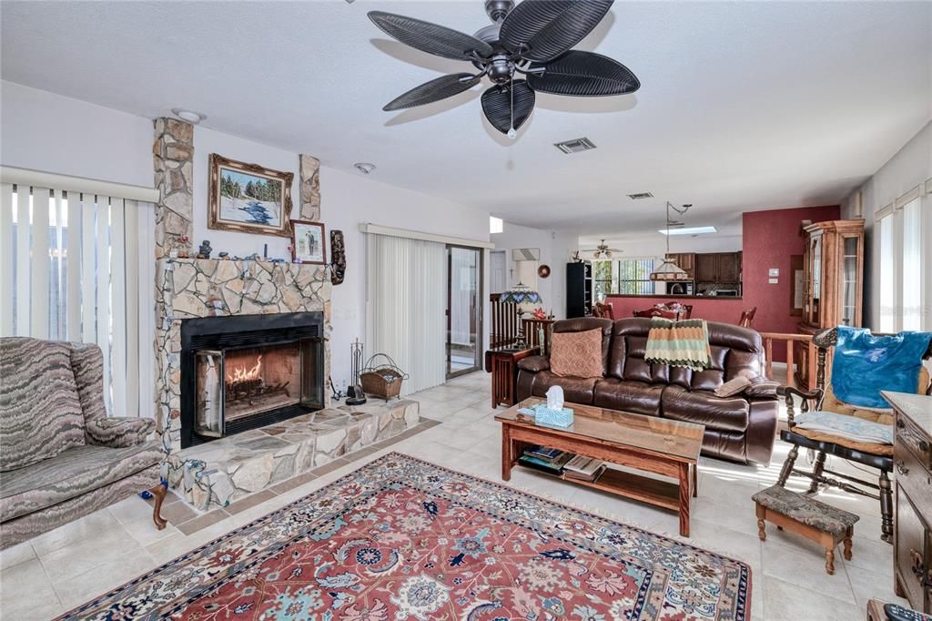 Spacious living room with wood burning fireplace