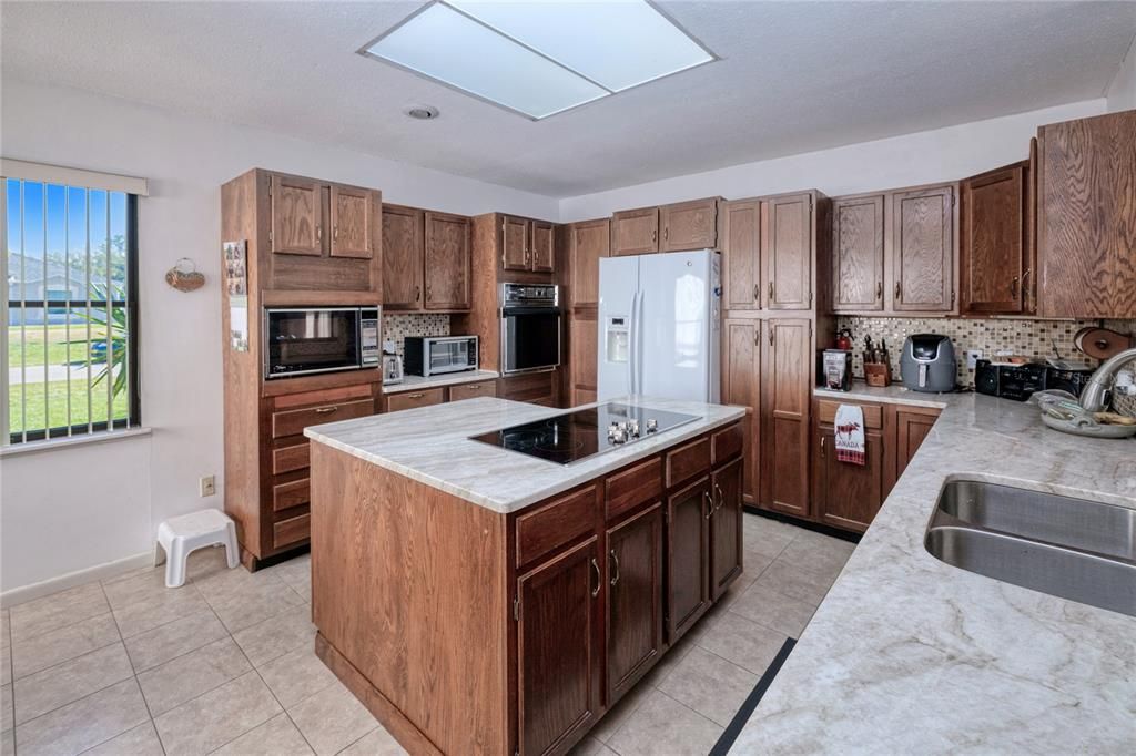 Additional view of large kitchen space with beautiful solid wood cabinets