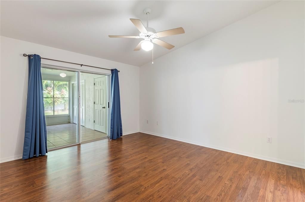 Primary Bedroom with Sliders to Florida Room