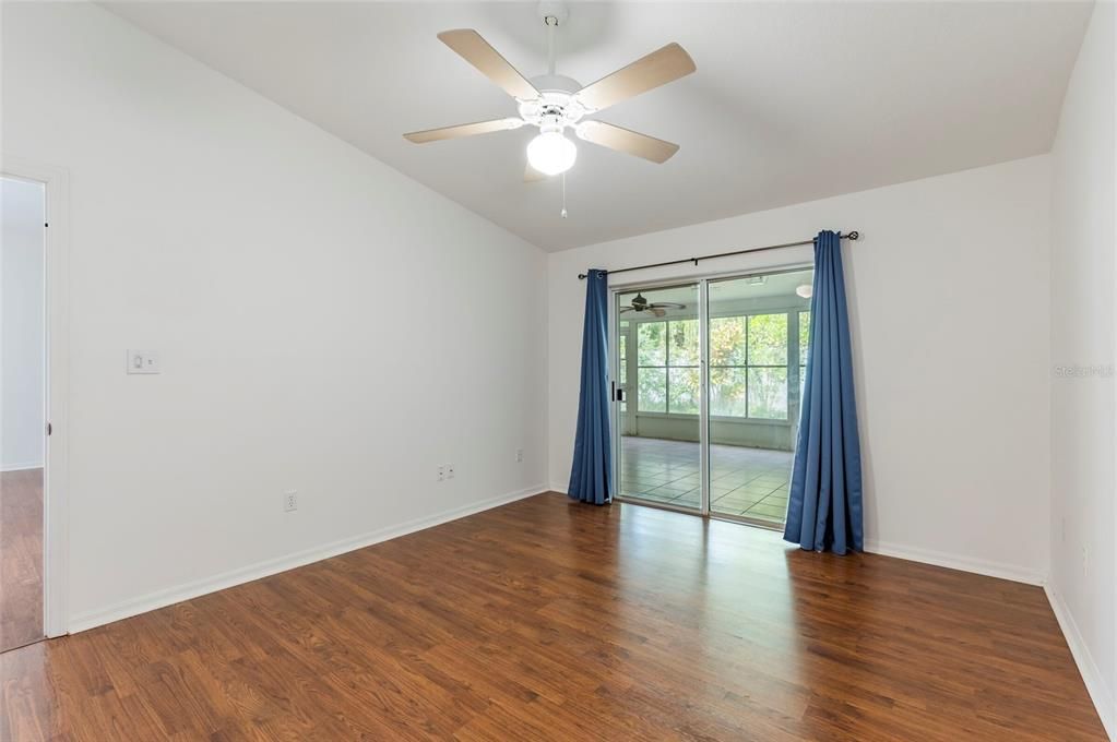 Primary Bedroom with Sliders to Florida Room