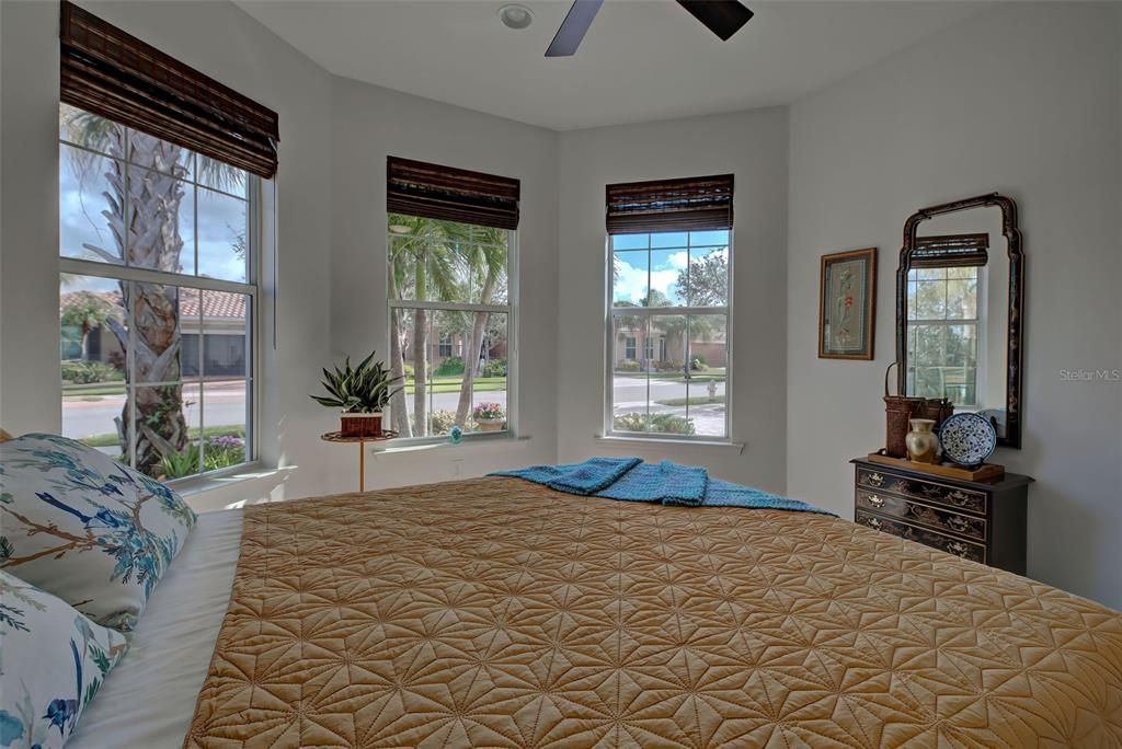 Guest room with turret windows allowing plenty of natural light