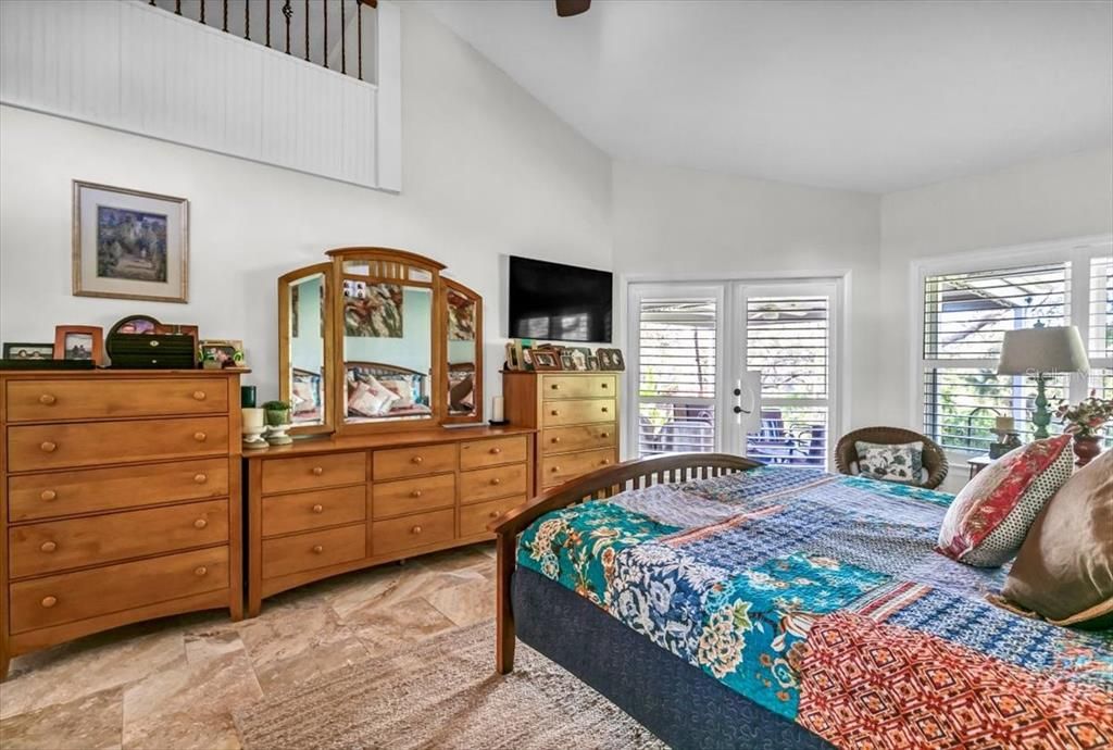 Primary bedroom with bonus loft area