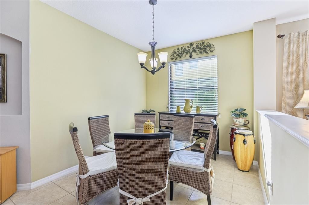 This space is being used as a Kitchen Nook but there are many uses for this extra space!