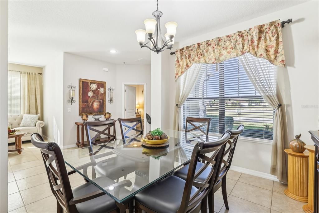 Formal Dining Room overlooking the Foyer, Front Door and Dual Primary Suite