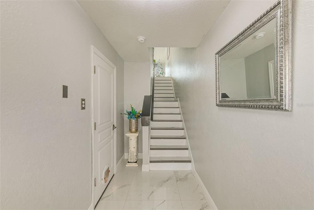 View of stair leading to living area of townhouse