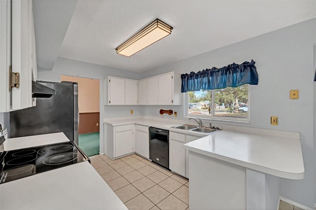 Kitchen with Eating Space and backyard views!