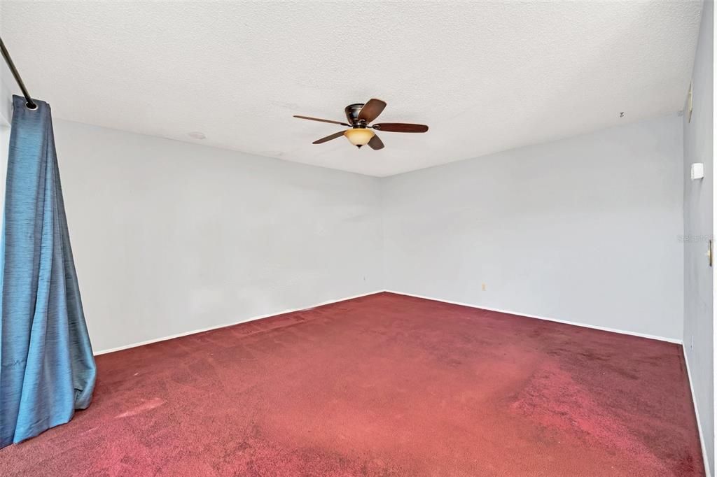 Family Room with sliding glass door access to covered and screened back patio