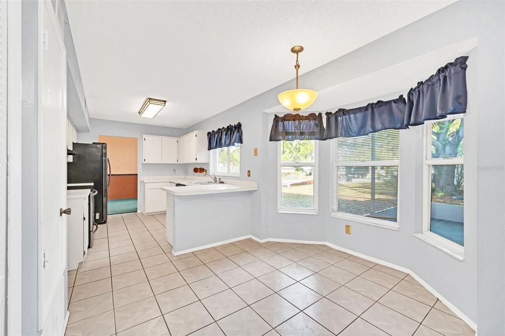 Kitchen with Eating Space and backyard views!