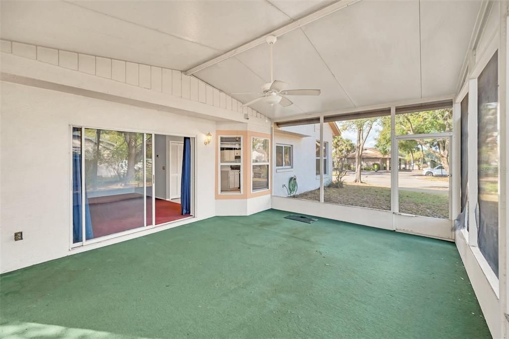 Family Room with sliding glass door access to huge covered and screened back patio