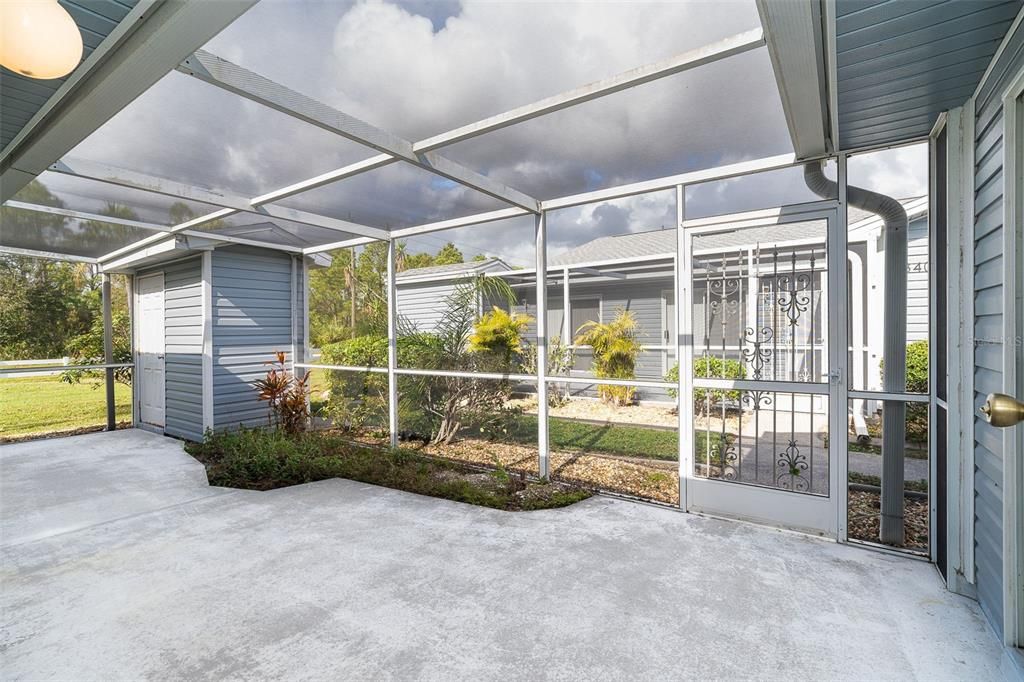 large lanai with storage shed