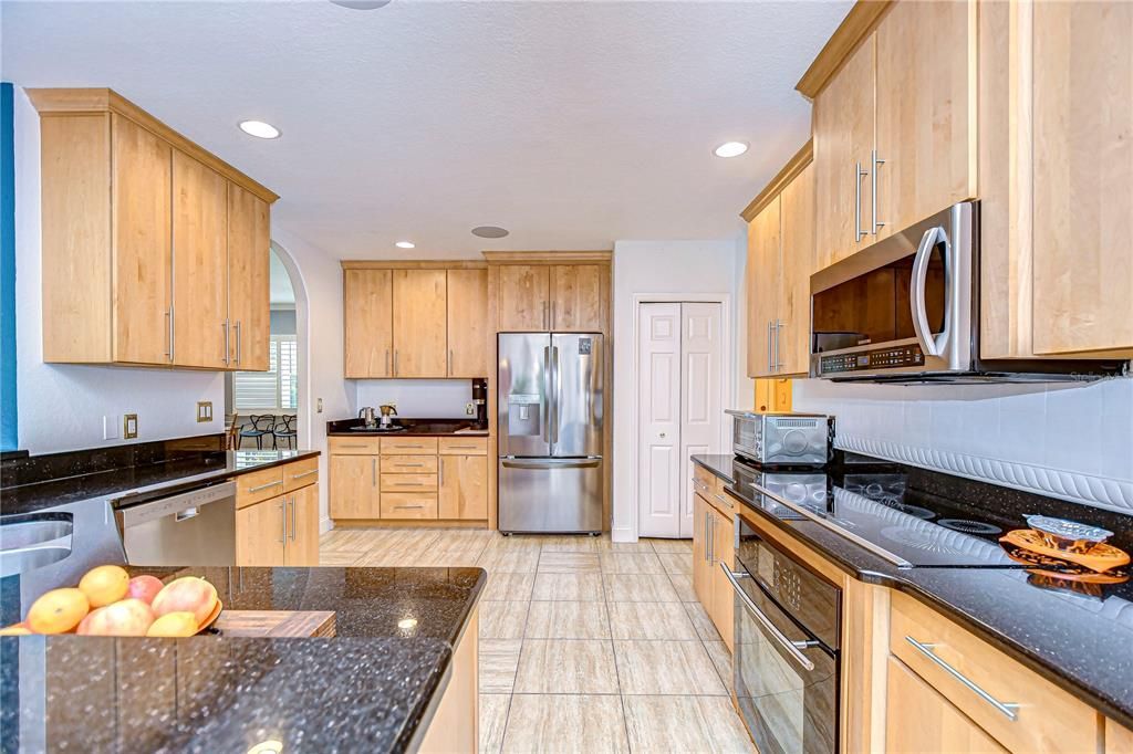 Expansive kitchen with vast storage space.