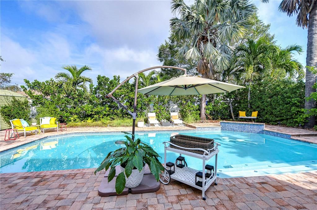 Plenty of seating areas to enjoy every inch of this fenced back yard!