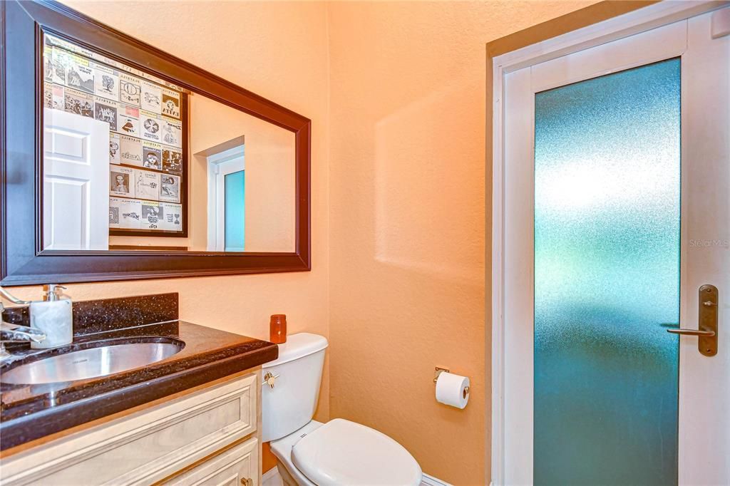 Convenient half bath on main bath accessible to the pool!