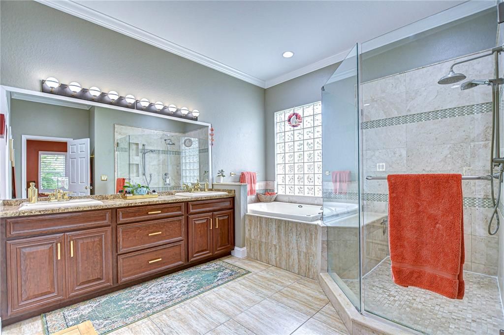 Updated en-suite bathroom features dual sinks, a soaking tub and a large walk-in shower!