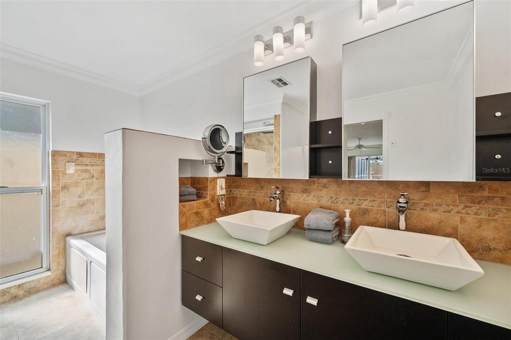 Master bath with jetted tub and dual sinks.