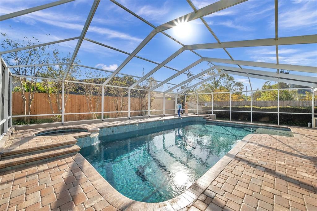 Look at the sunshine that comes in this yard! The hot tub can heat the pool.