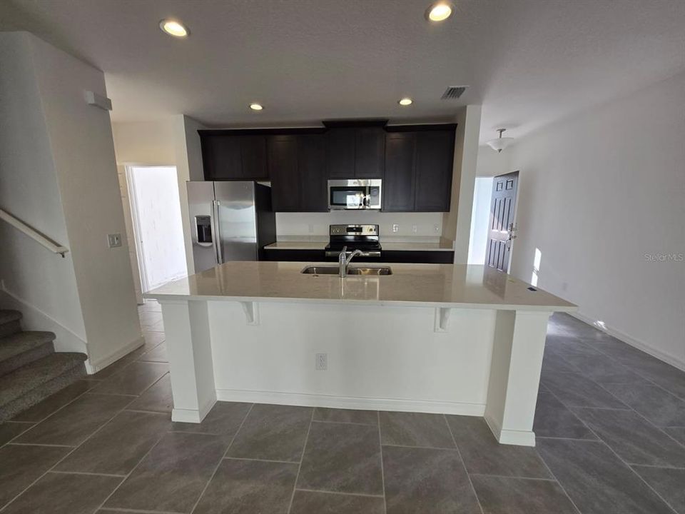 Kitchen. Garage entrance left. Main entrance right.