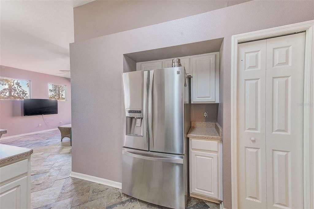 KITCHEN WITH NEWER STAINLESS REFRIGERATOR & CLOSET PANTRY