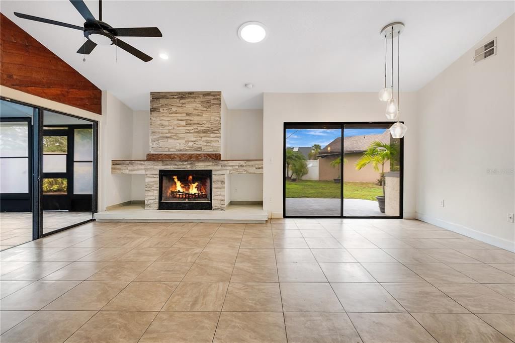 living room/dining room combo with fireplace