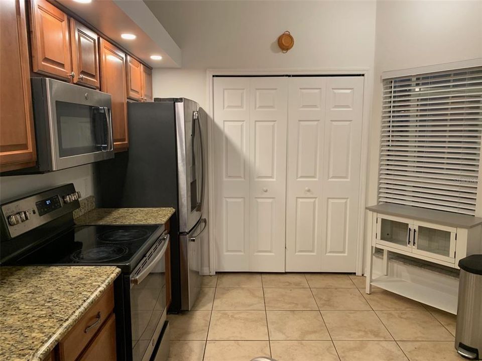 Kitchen - maple colored cabinets.