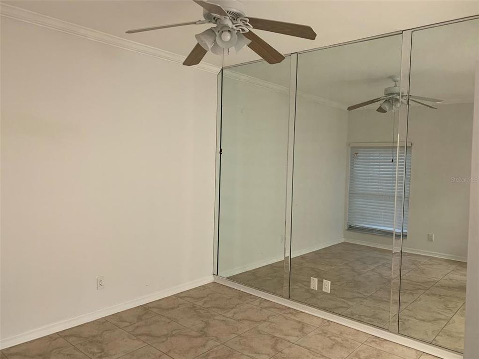 Guest bedroom with ceiling fan.