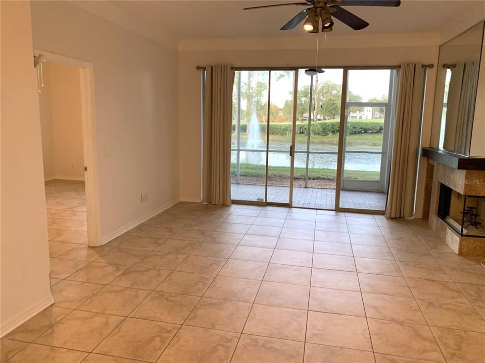 Great room with ceiling fan.