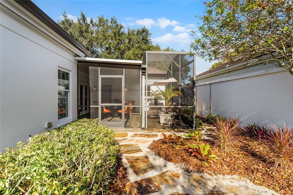 Yard forward the screened patio.