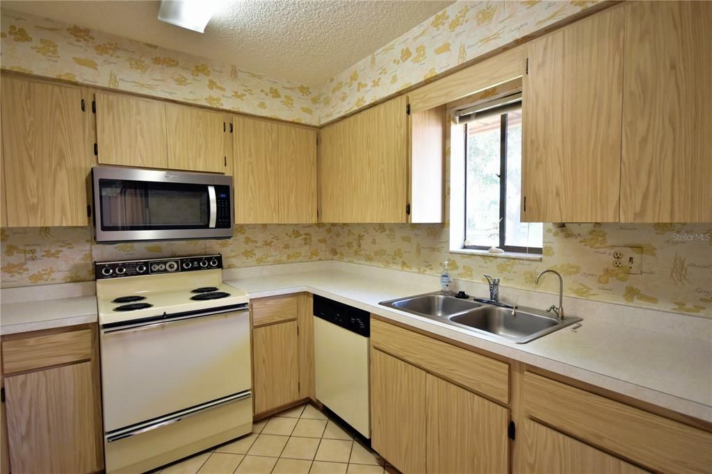 Kitchen with view of pond from sink