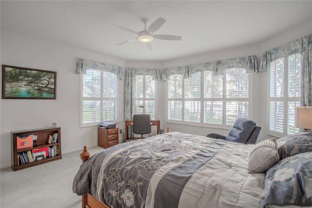 Primary bedroom with panoramic lake view