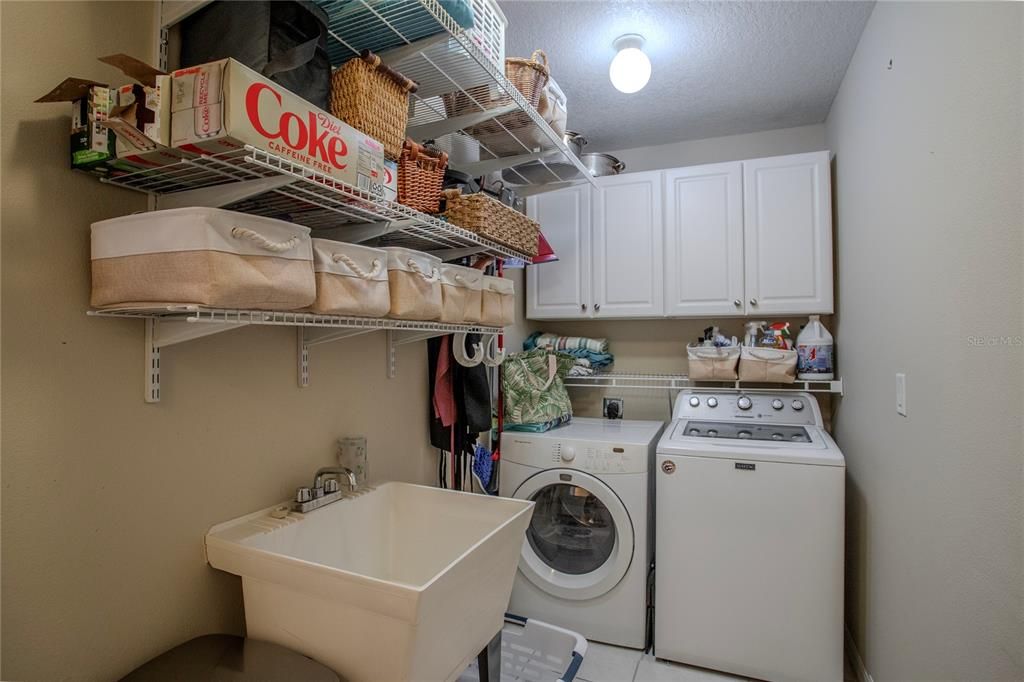 Laundry Room with lots of room, sink, and storage.