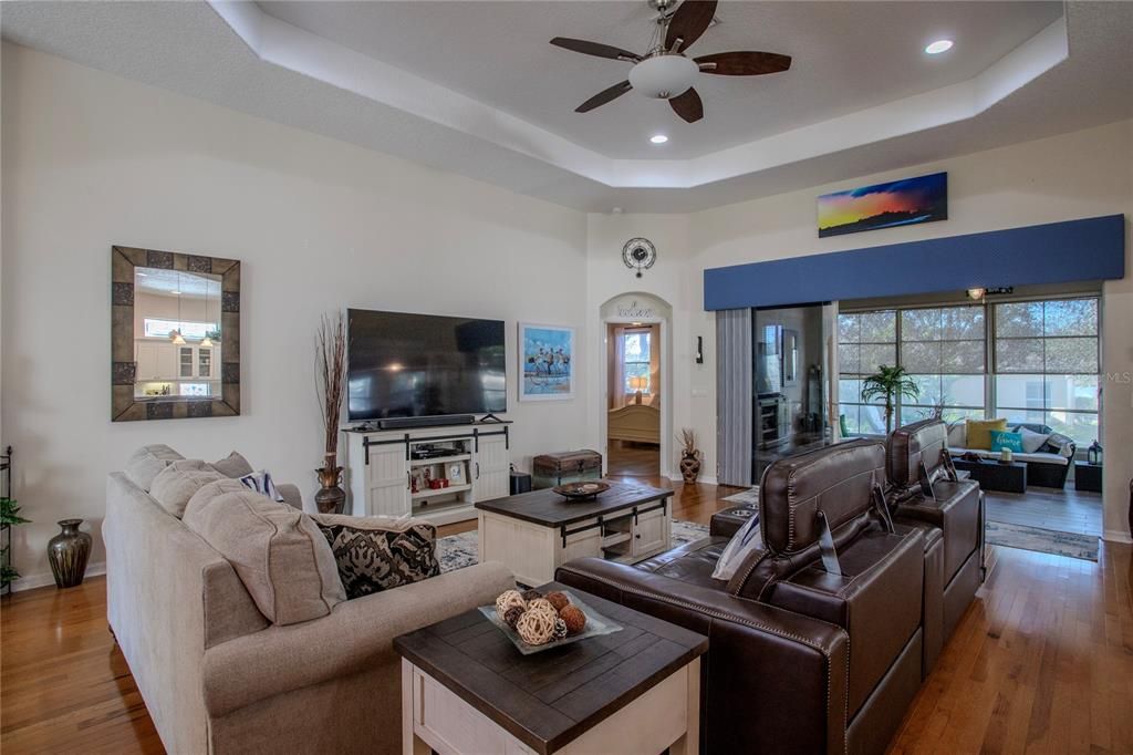 Great Room with high trey ceiling and lovely lanai view