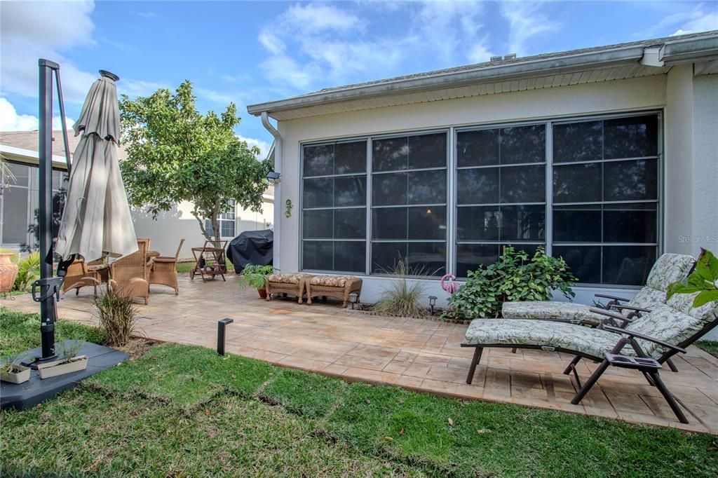 Large paved patio for outdoor gatherings.