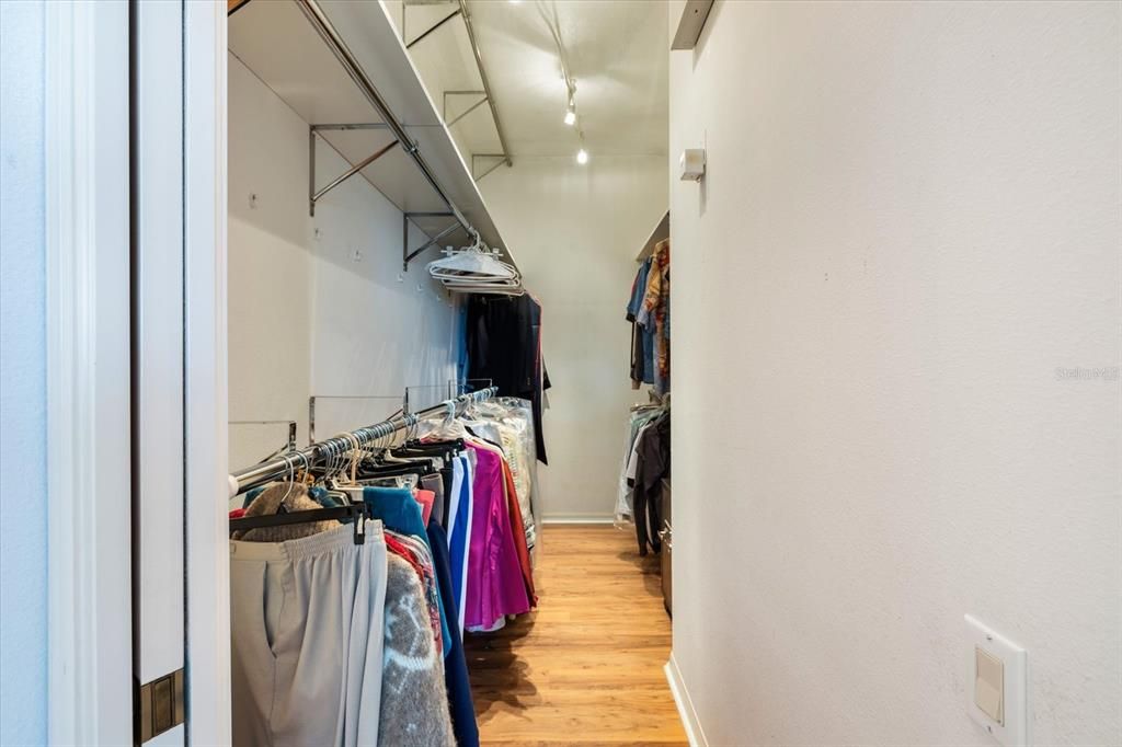 Huge primary closet with lots of storage