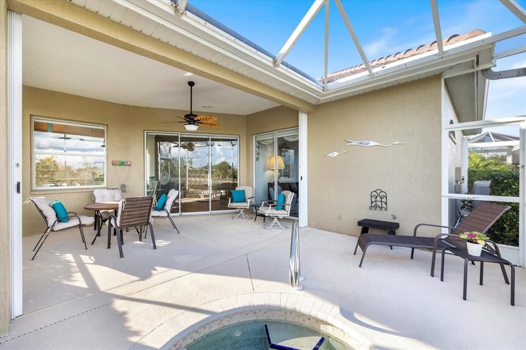 Large covered lanai with heated spa