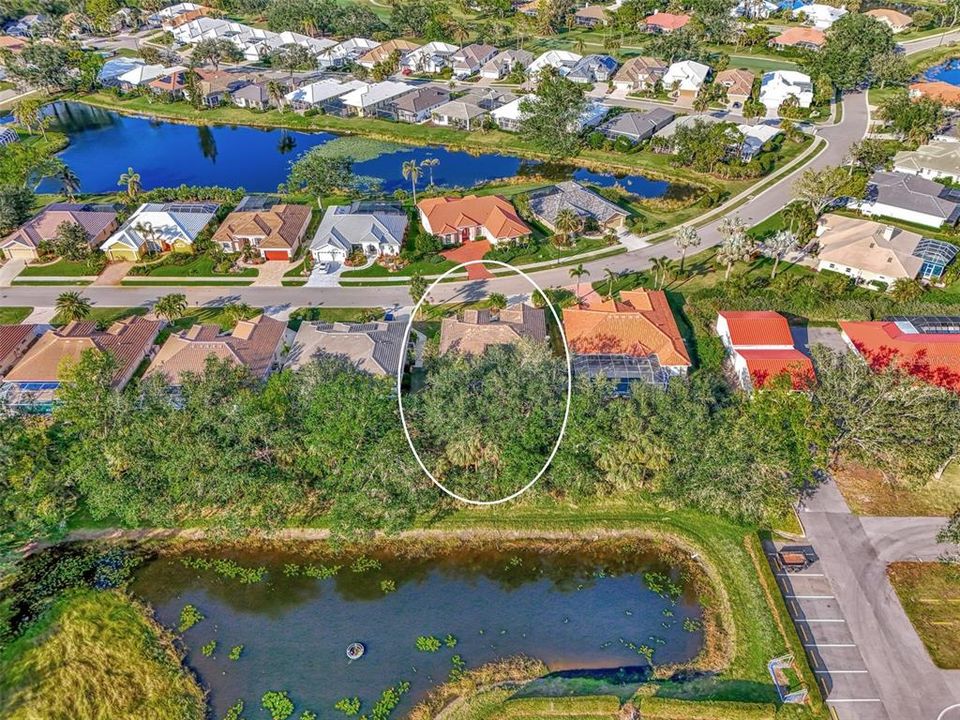 House is buffered with pond and landscaping