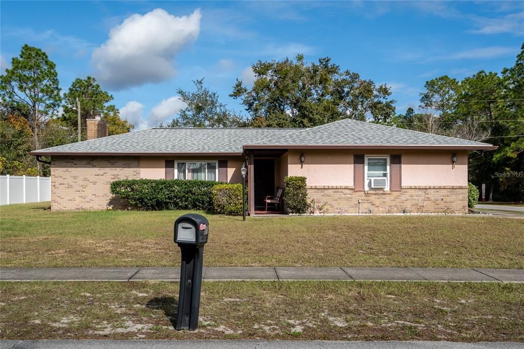 2/2 home with huge bonus room and 2024 roof on large, corner lot.