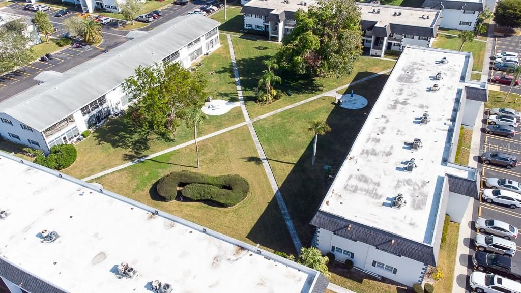 Subject condo is at the bottom of this photo looking east to the courtyard.