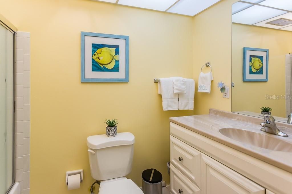 Even the bathroom is bright with this striking yellow paint.