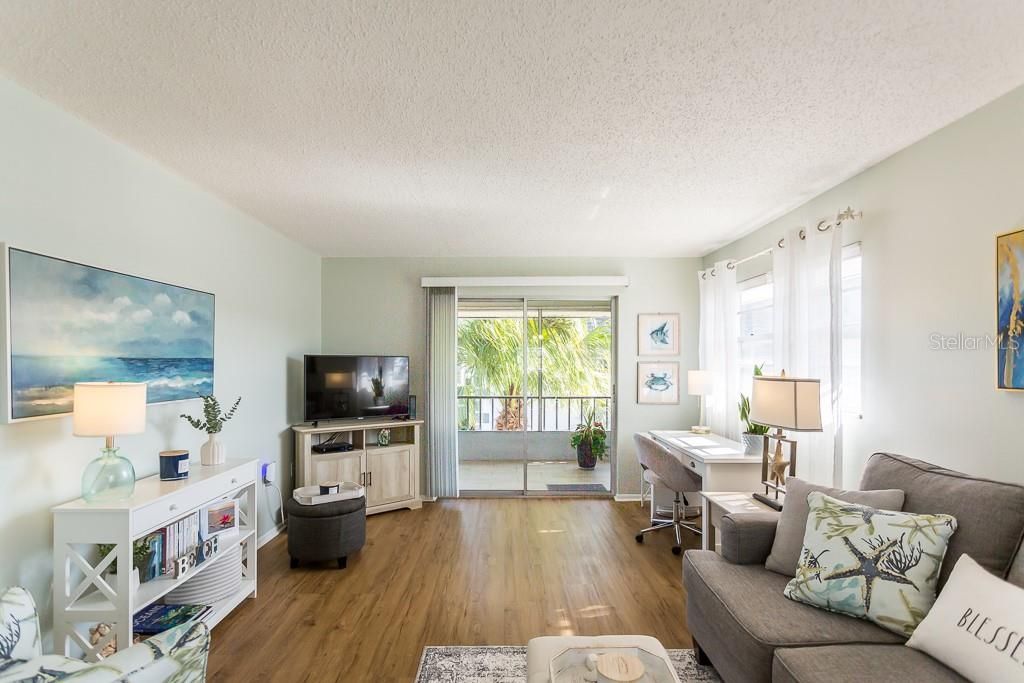 Laminate floor in the living area leading to the lanai.