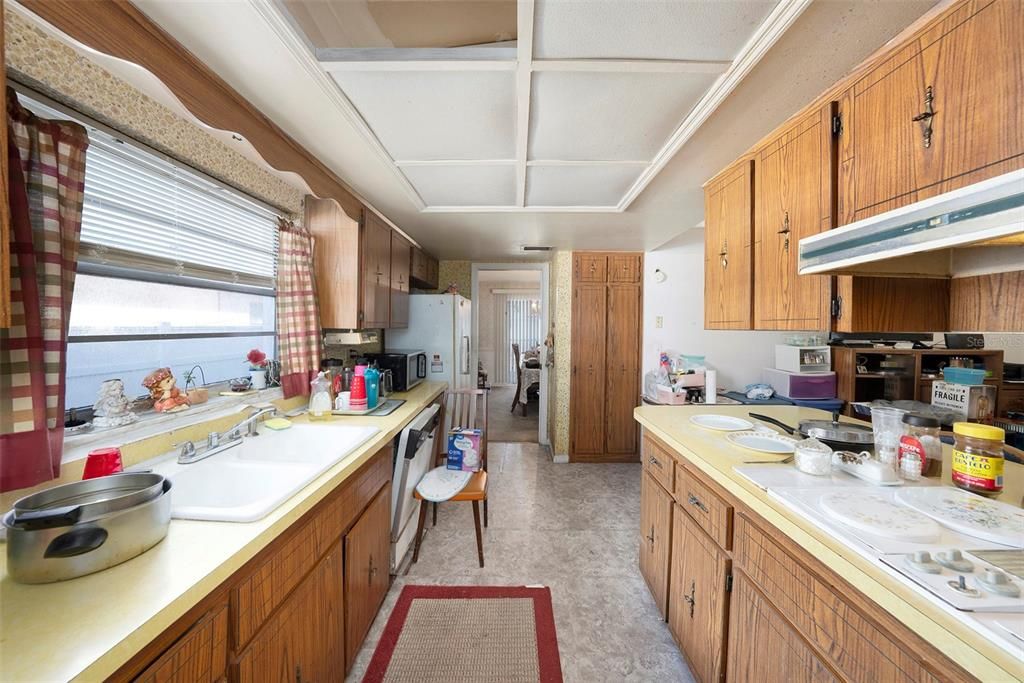 Remove the ceiling cabinets to open up the kitchen!